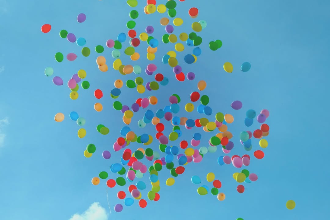 Colorful balloons are able to lighten up the mood. - https://unsplash.com/lucist...
